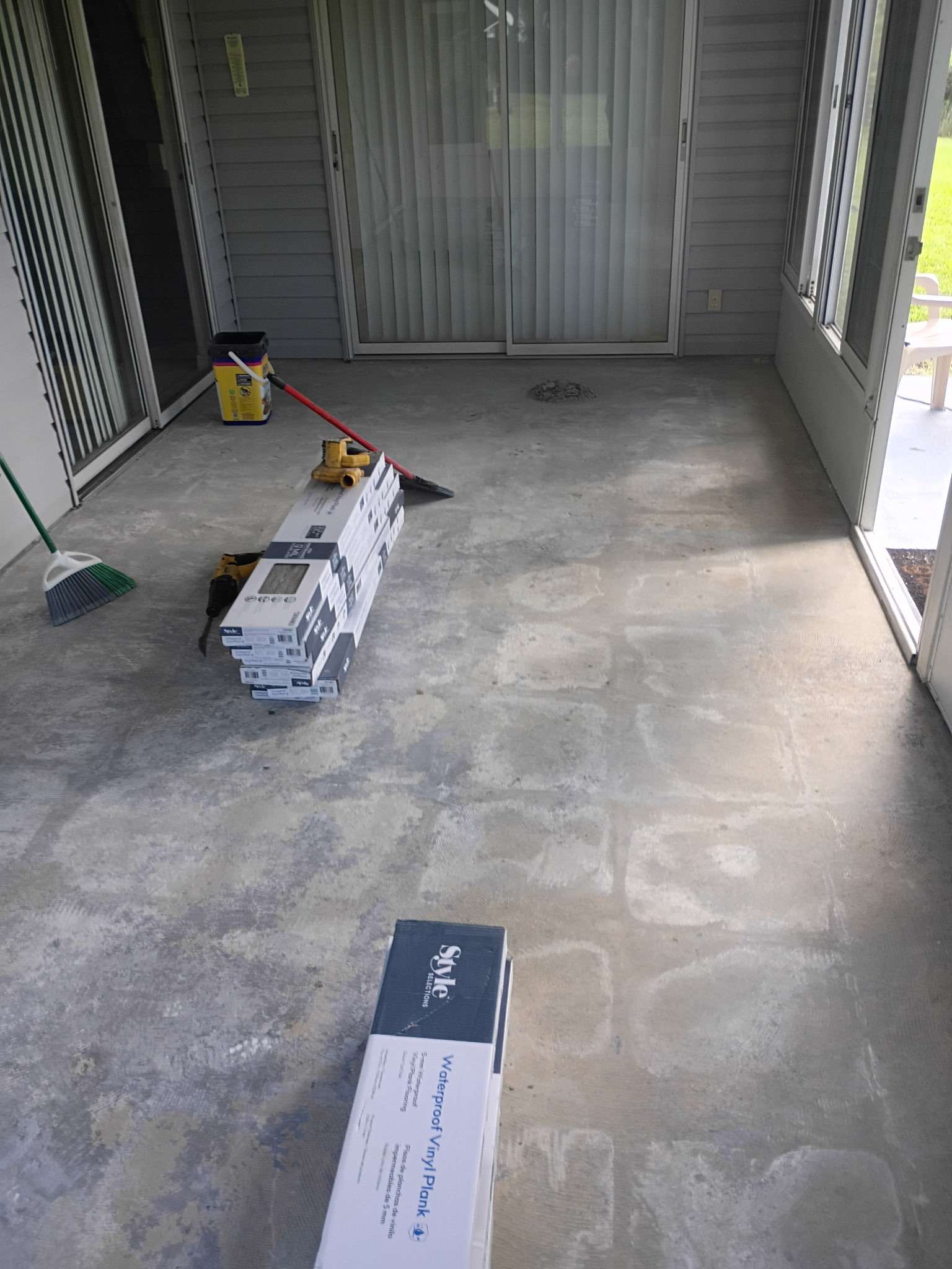 Sunroom concrete slab before new vinyl plank flooring